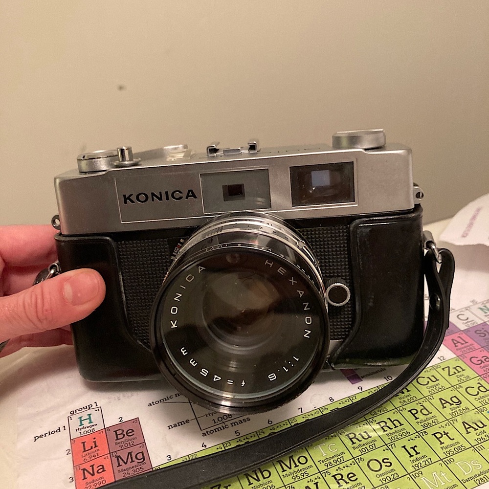 Vintage Konica film camera with attachable case